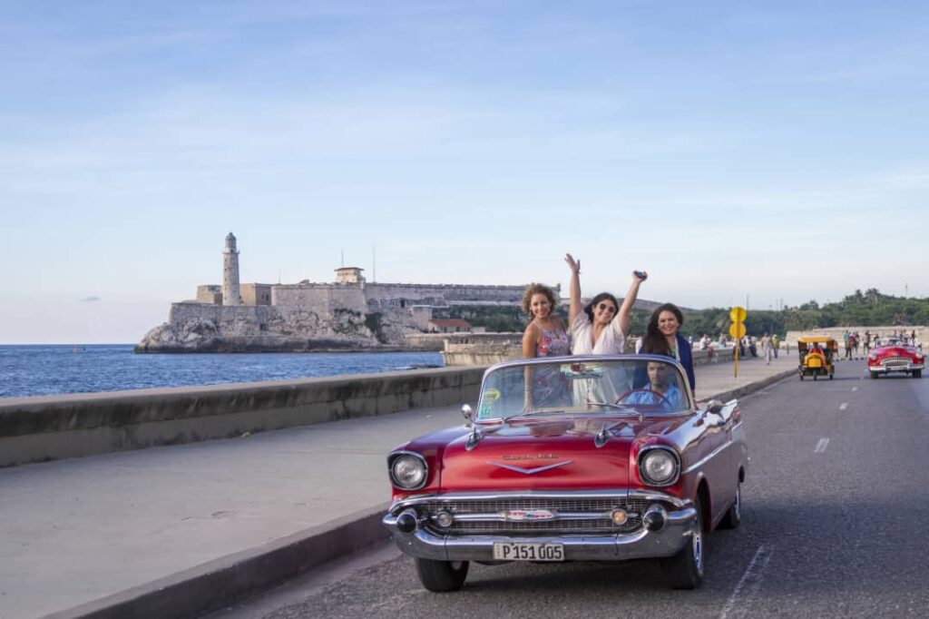 Car red malecon hands up